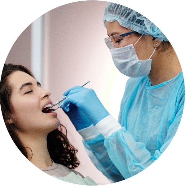 Hygentist cleaning patient teeth