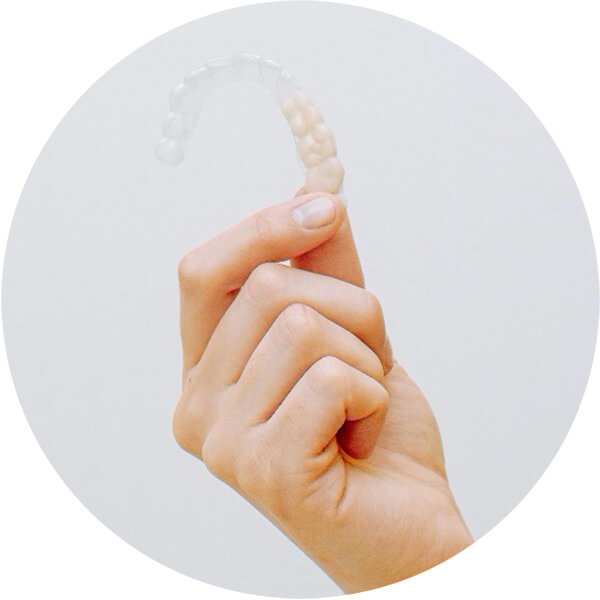 Invisalign product held in a hand